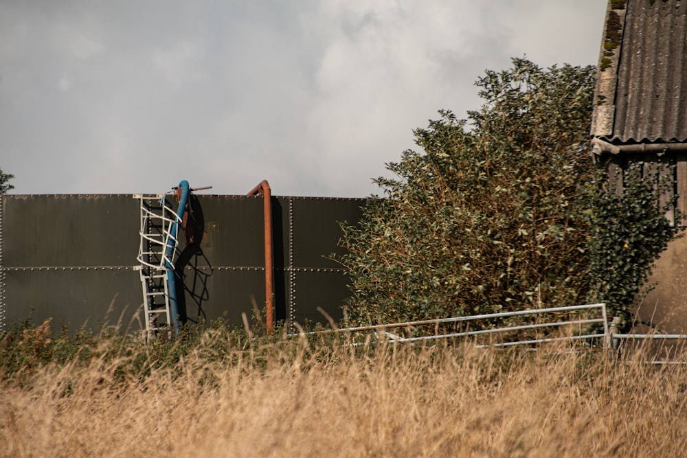 a man climbing a ladder up a metal structure