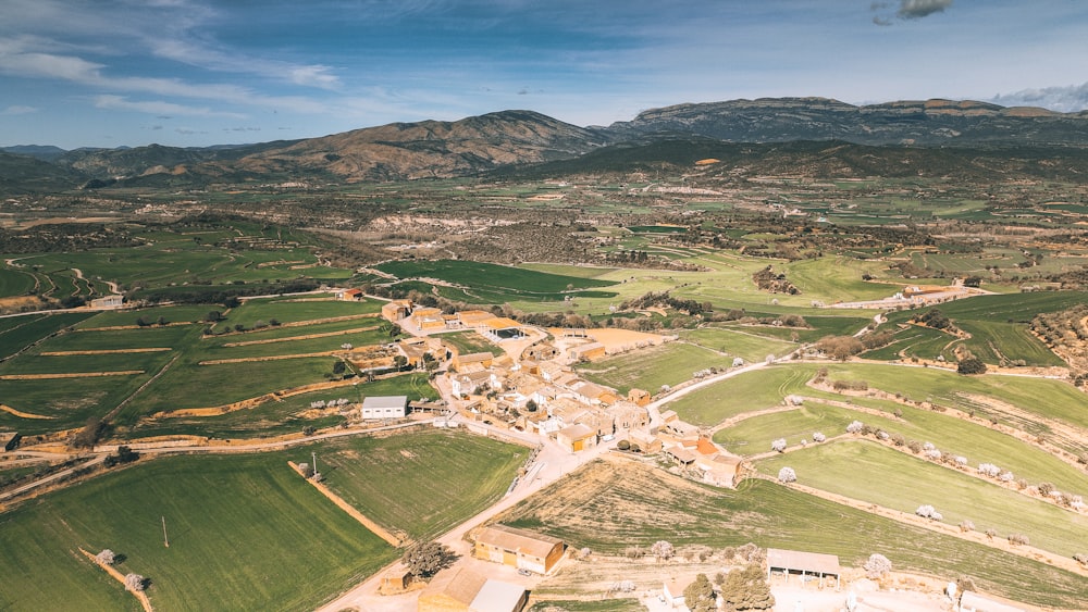 an aerial view of a small town in the mountains