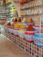 A vibrant display of Rajasthan spices in colorful jars.
