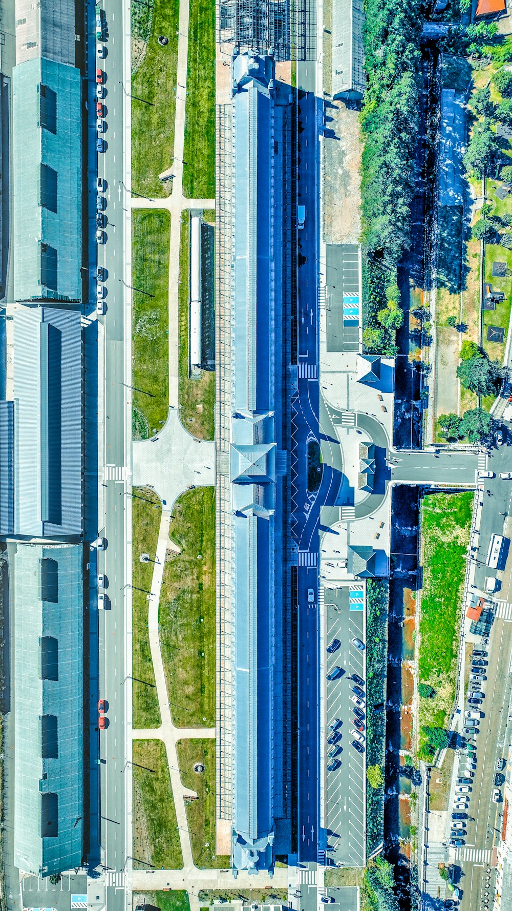 an aerial view of a parking lot with cars parked in it