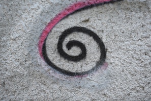 a picture of a spiral painted on a wall