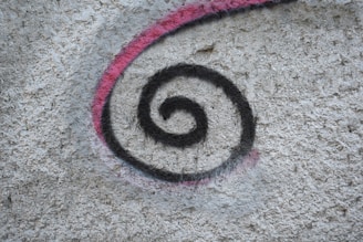 a picture of a spiral painted on a wall