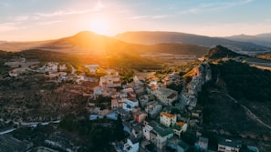 A sunset view over a village where the association has recently completed a water well project.