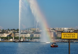 Scenic view of Lake Geneva with banners and signs promoting digital sustainability.