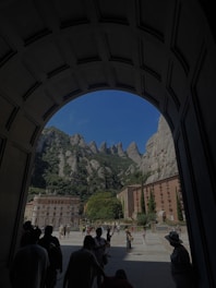 A group of visitors exploring traditional architecture in Monte San Juan.
