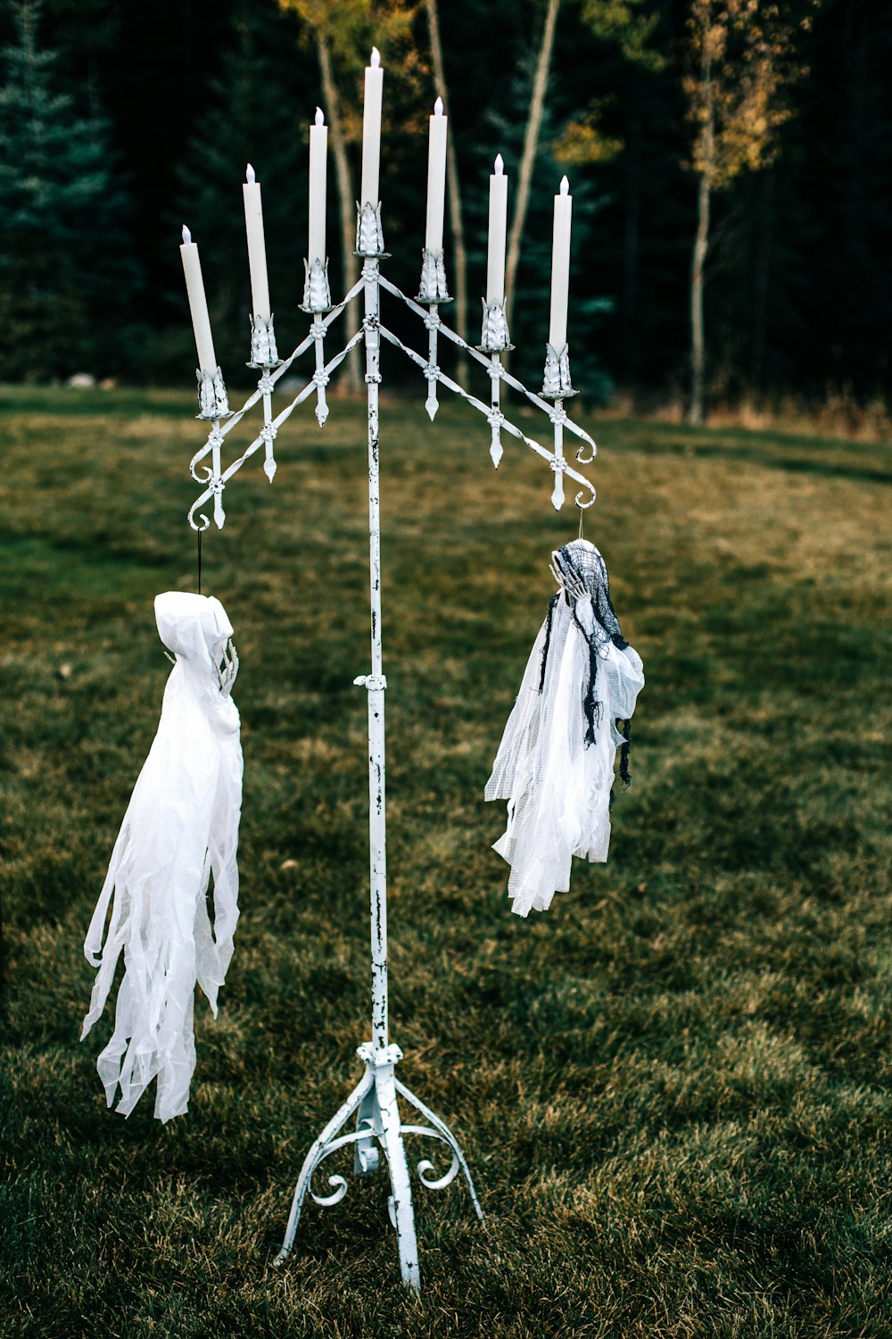 a tall white candelabra with candles on it