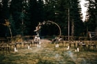 an outdoor ceremony set up in the woods