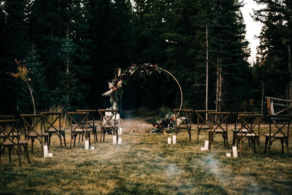 an outdoor ceremony set up in the woods