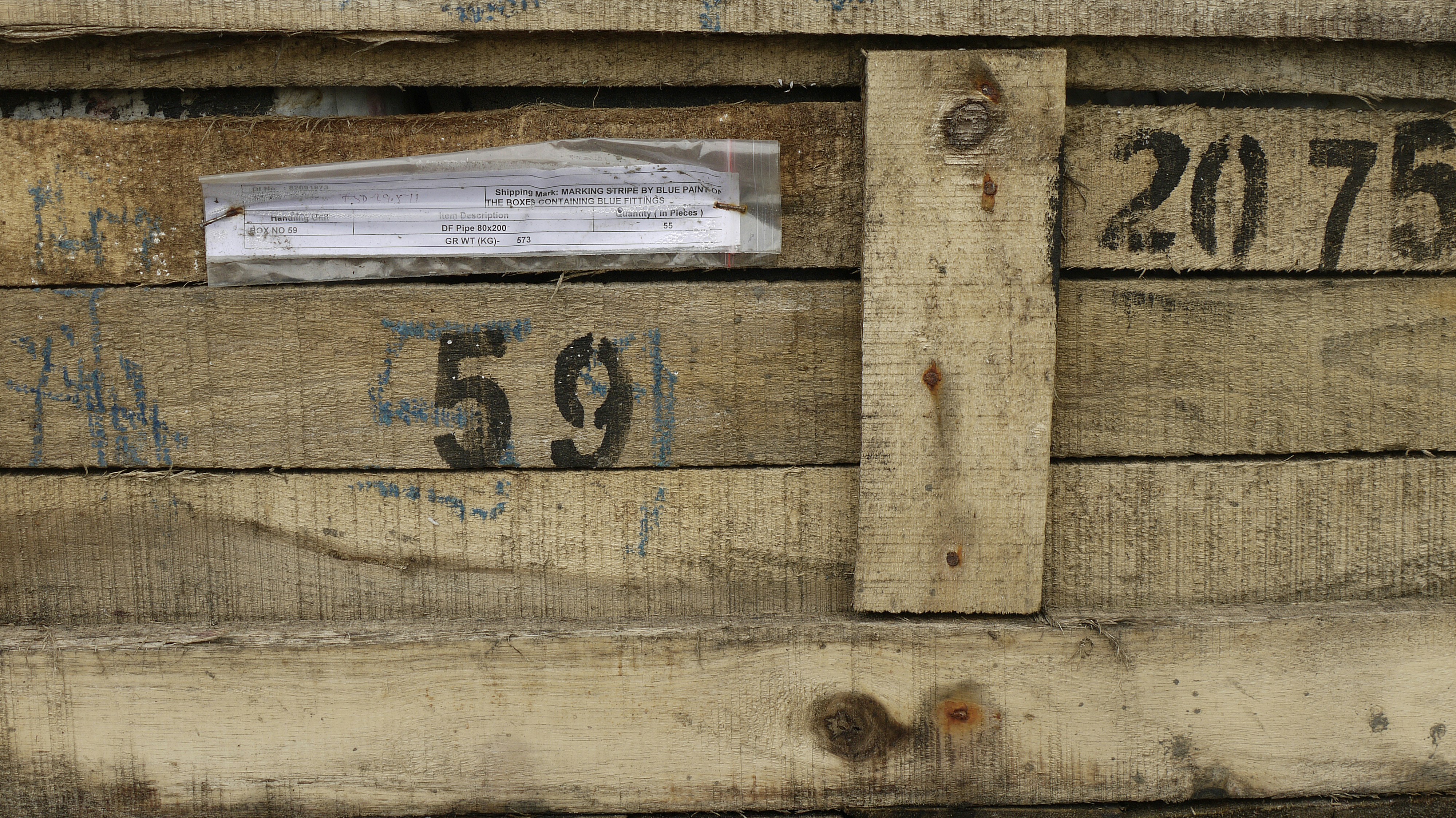 a close up of a piece of wood with numbers on it