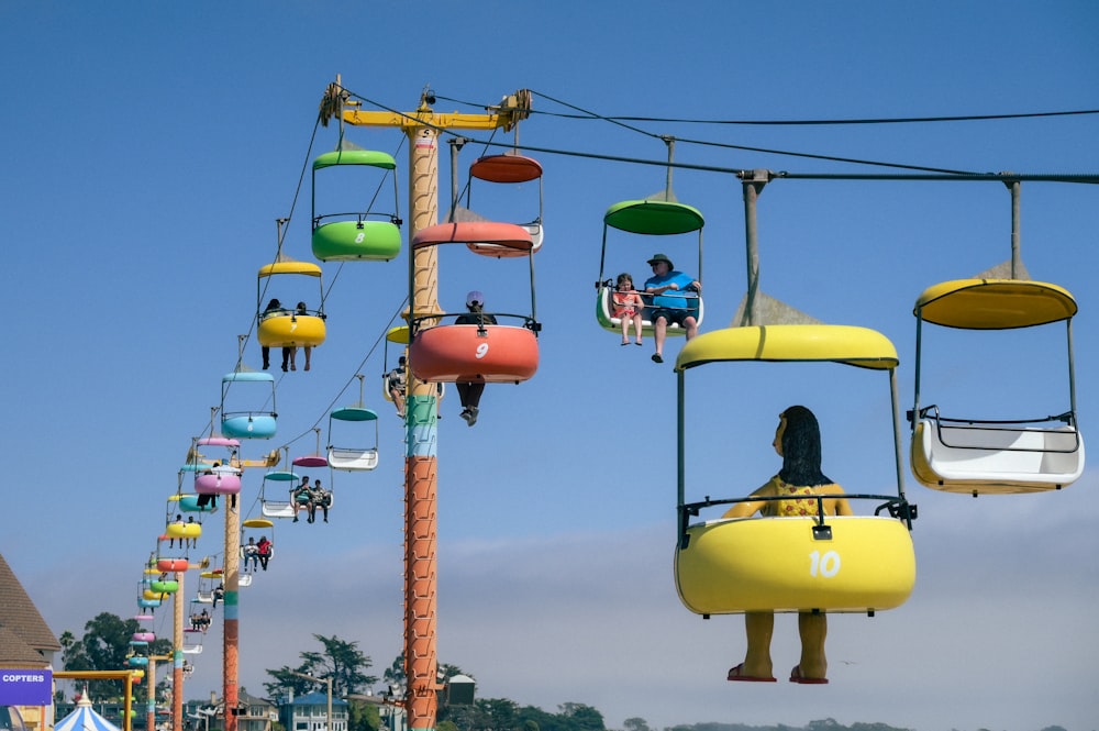 a number of people riding a ride on a roller coaster