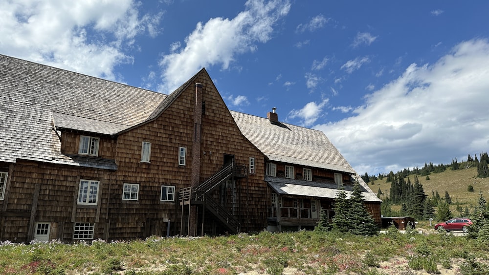 a large wooden building with a steeple on top of it