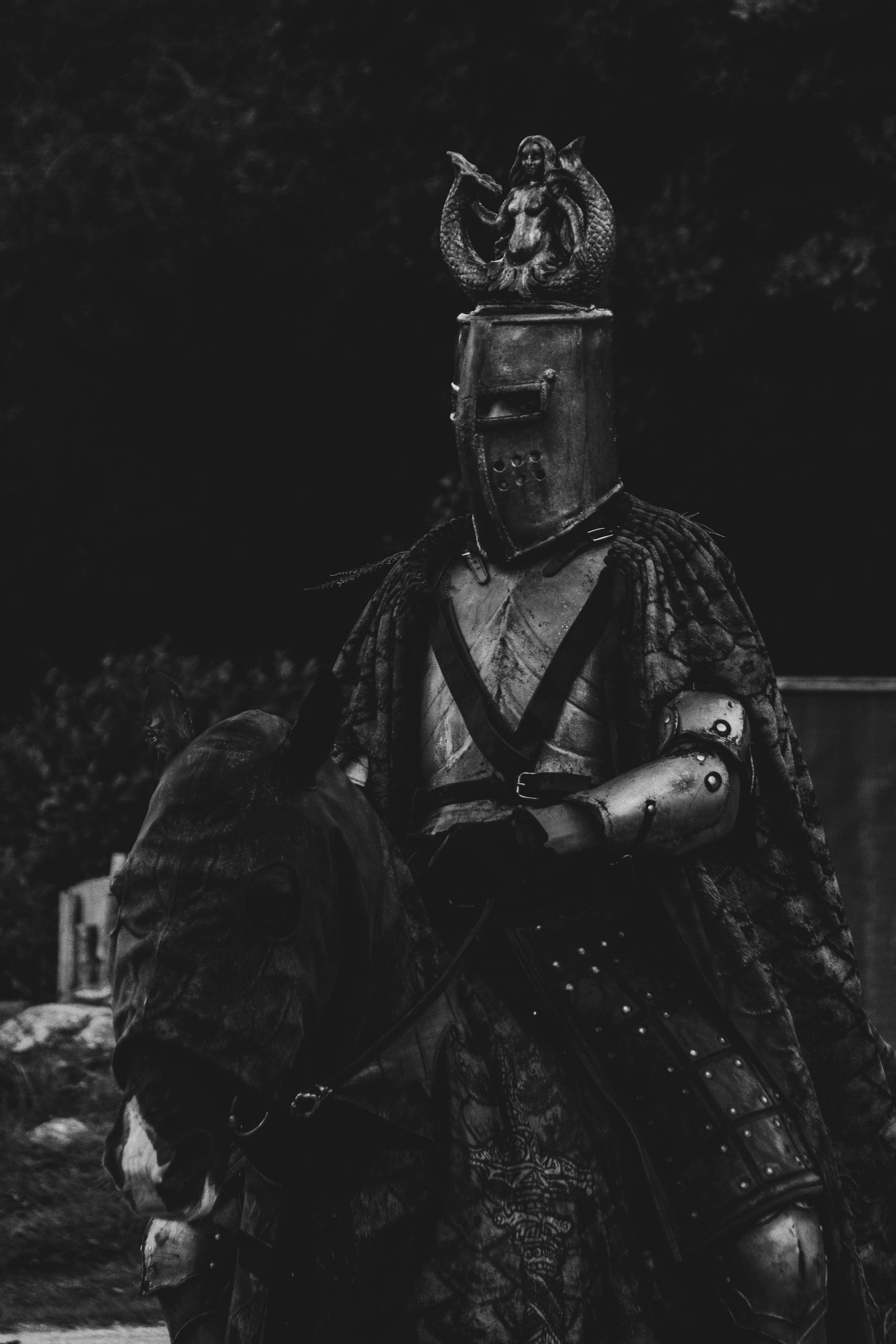 a black and white photo of a knight