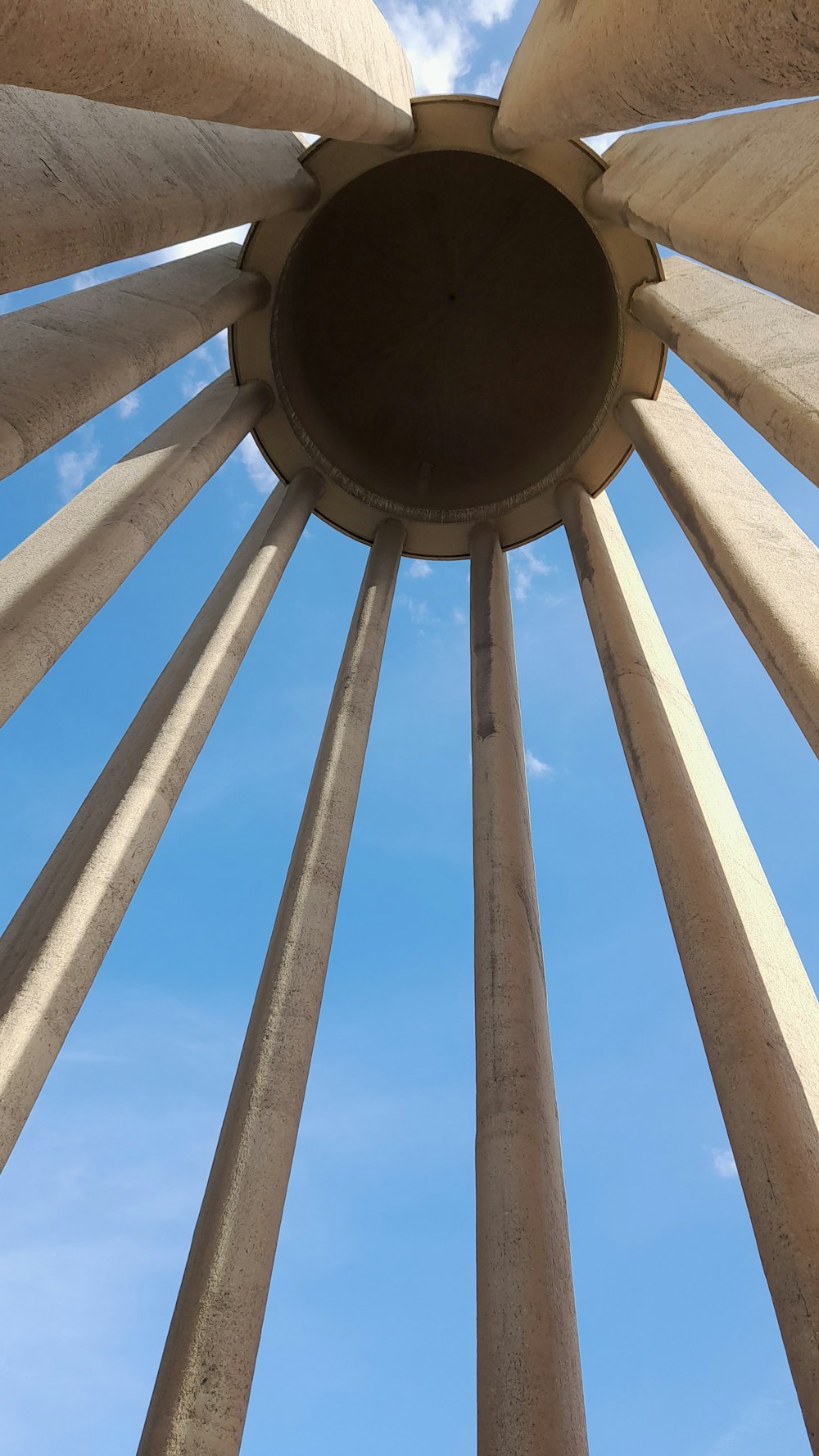 a view of the top of a structure with a blue sky in the background