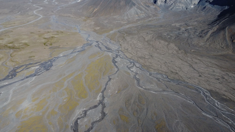 an aerial view of a mountain range with a river running through it