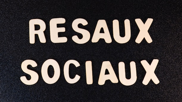 a close up of two white letters on a black surface