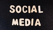 the word social media written in white type on a black background