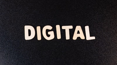 The word 'DIGITAL' is displayed in bold white letters against a plain black background.