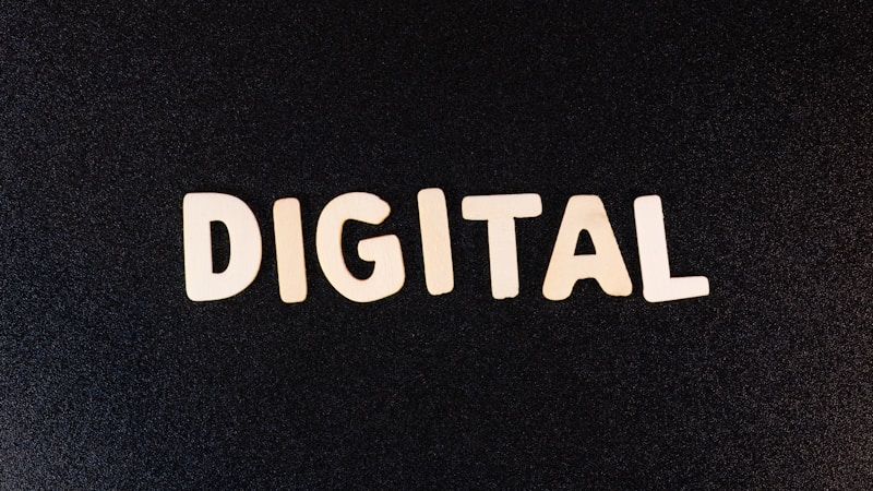 The word 'DIGITAL' is displayed in bold white letters against a plain black background.