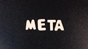 a close up of a black surface with white letters