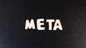 a close up of a black surface with white letters