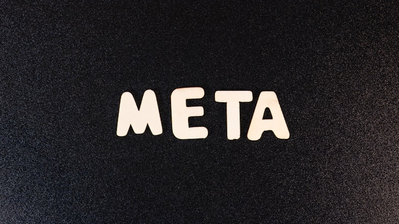 a close up of a black surface with white letters