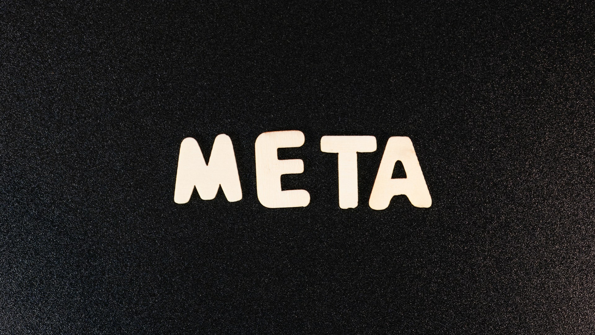 a close up of a black surface with white letters