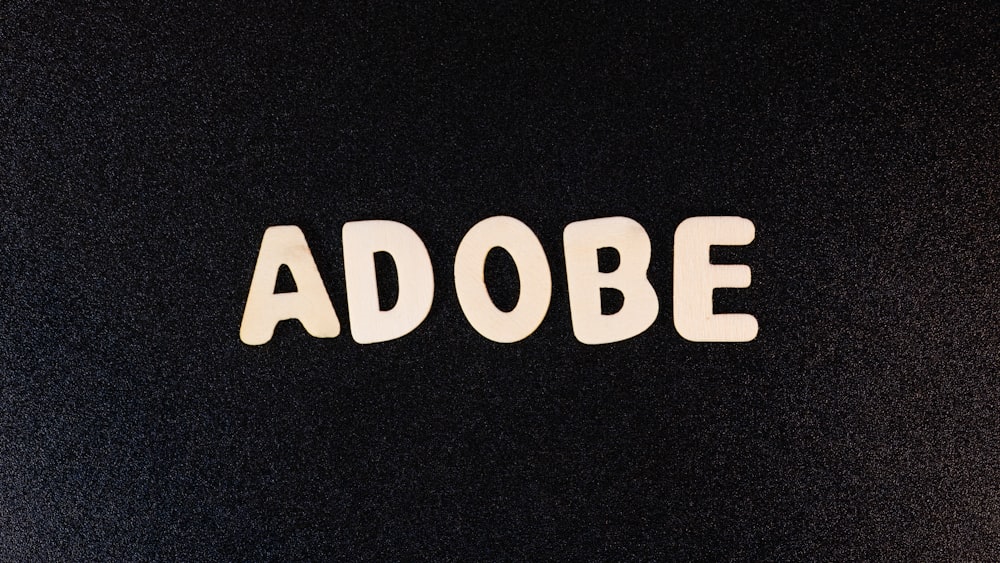 the word adobe spelled with white letters on a black background