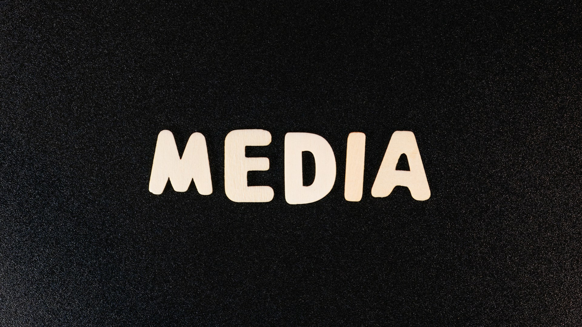 the word media spelled with white letters on a black background