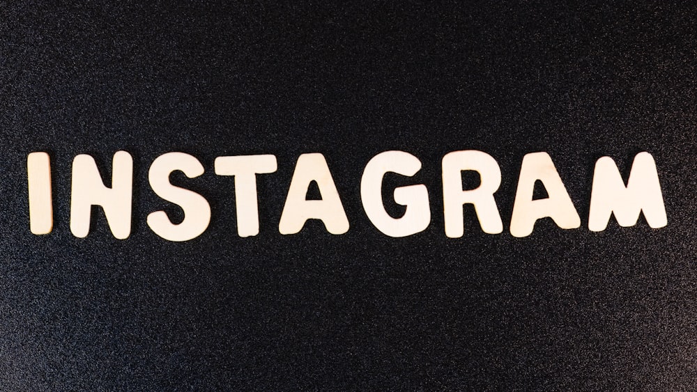 the word instagram spelled in white letters on a black background