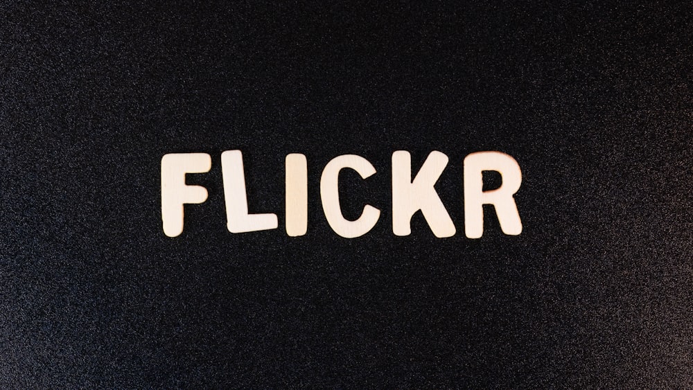 the word flickr spelled with white letters on a black background