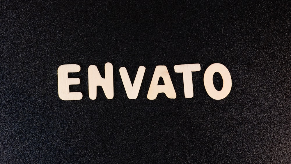the word envato written in white on a black background