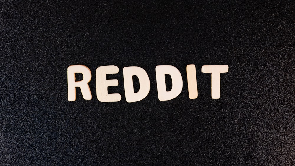 the word reddit written in white type on a black background