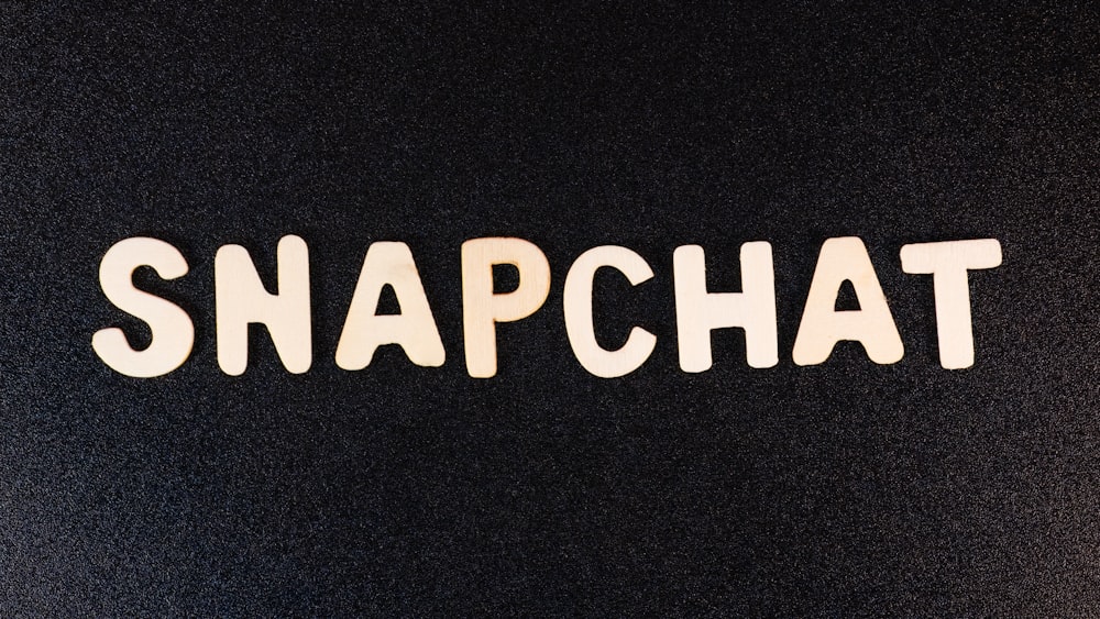 the word snapchat written in white type on a black background