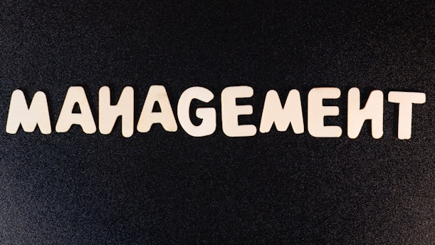 the word management written in white letters on a black background