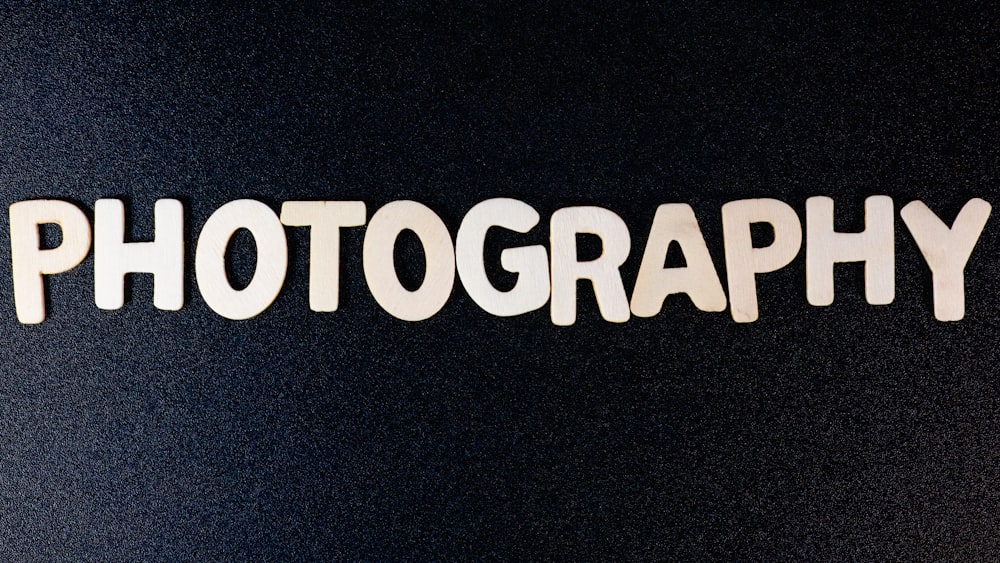 the word photography spelled with cut out letters