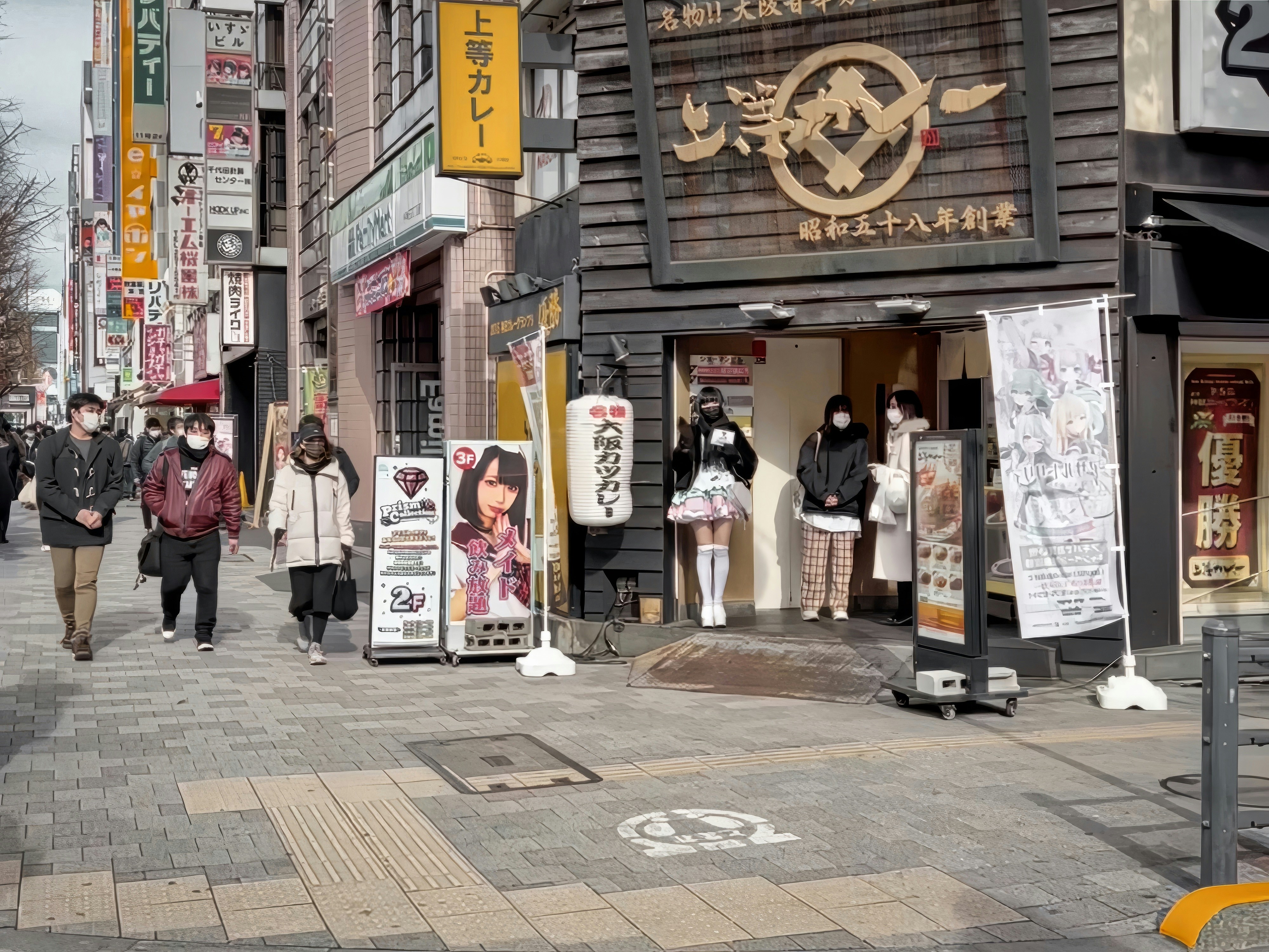 a group of people walking down a street next to tall buildings, A sidewalk corner scene taken in Winter, Akihabara, Tokyo, Japan.