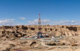 a drilling rig in the middle of a desert