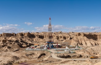 a drilling rig in the middle of a desert