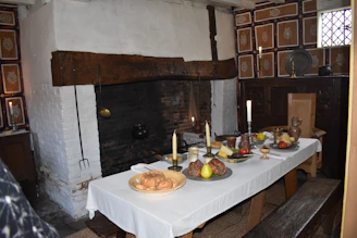 Cozy rustic kitchen table with traditional Portuguese dishes and regional ingredients from Serra da Lousã.