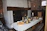 A cozy dining setup in a rustic Savoyard farmhouse.