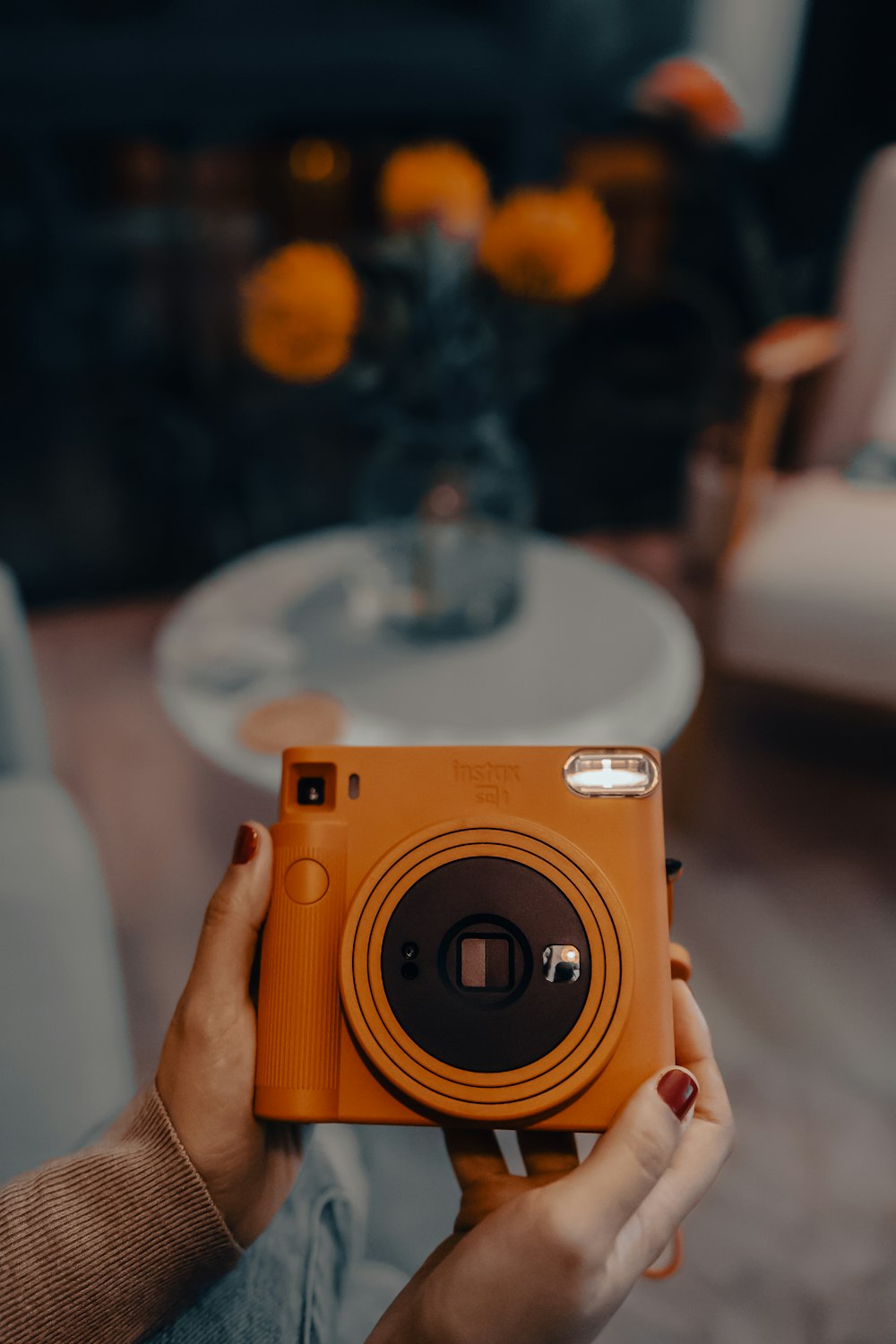 a person holding a camera in their hands