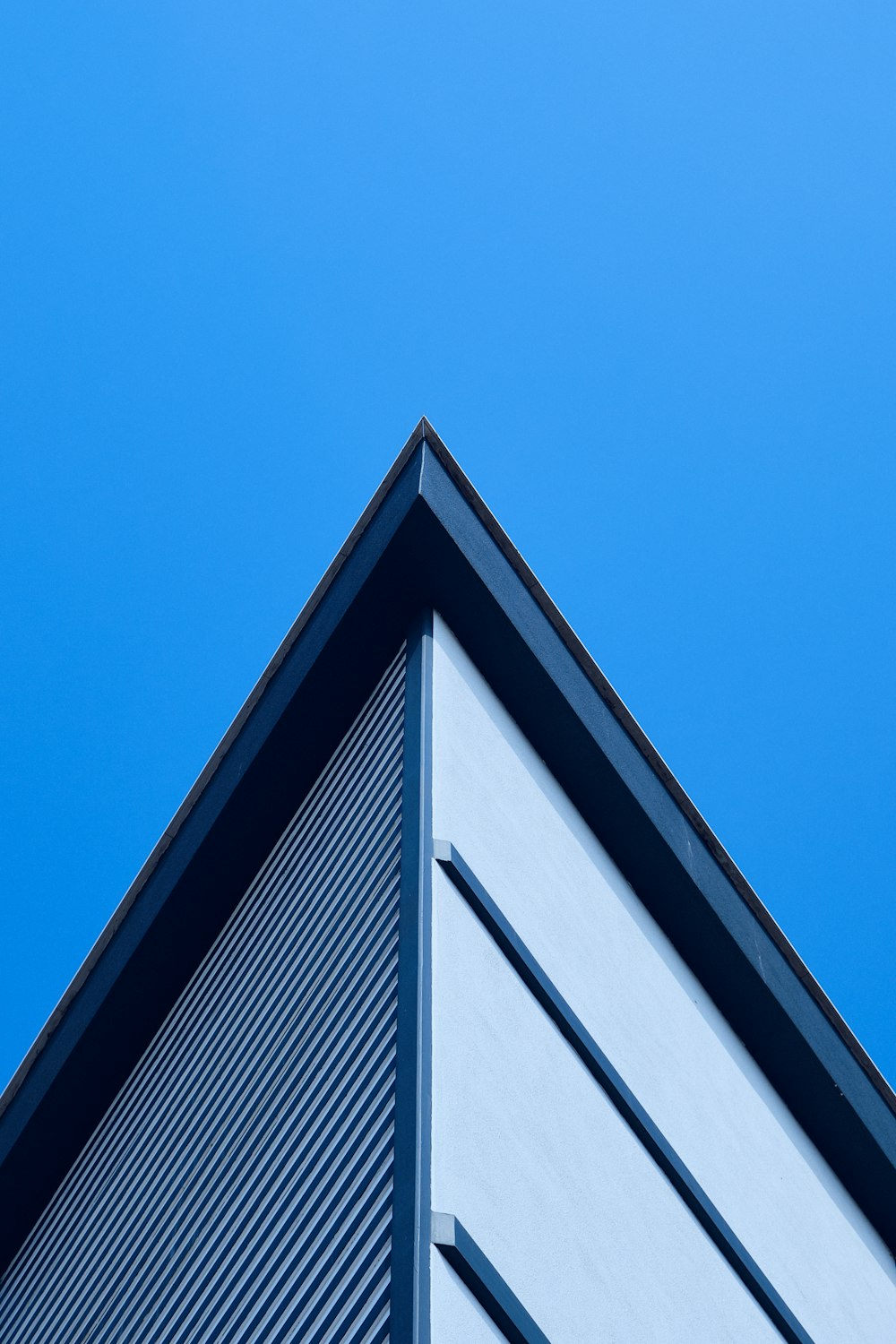 a close up of a building with a blue sky in the background