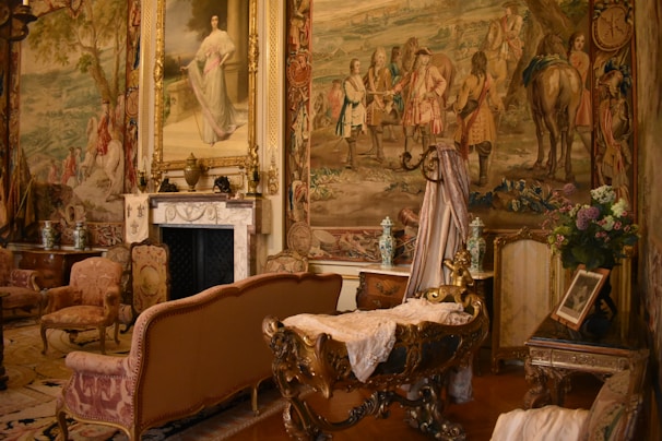 Cozy and elegant room featuring handcrafted tapestries on the walls.