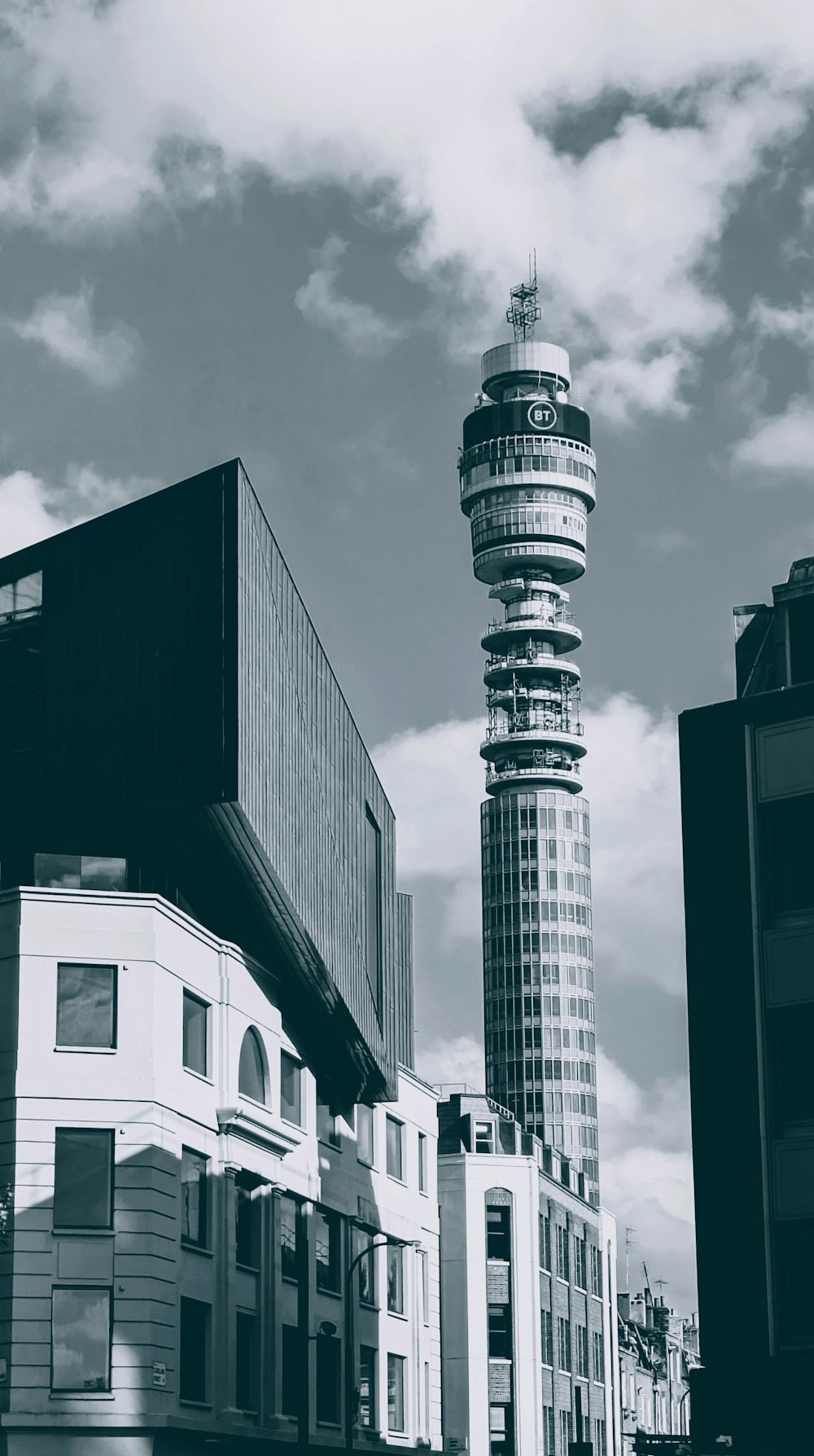 a black and white photo of a tall tower