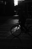 A cyclist silhouette riding in a vibrant city scene, symbolizing El Diablo Ciclista.