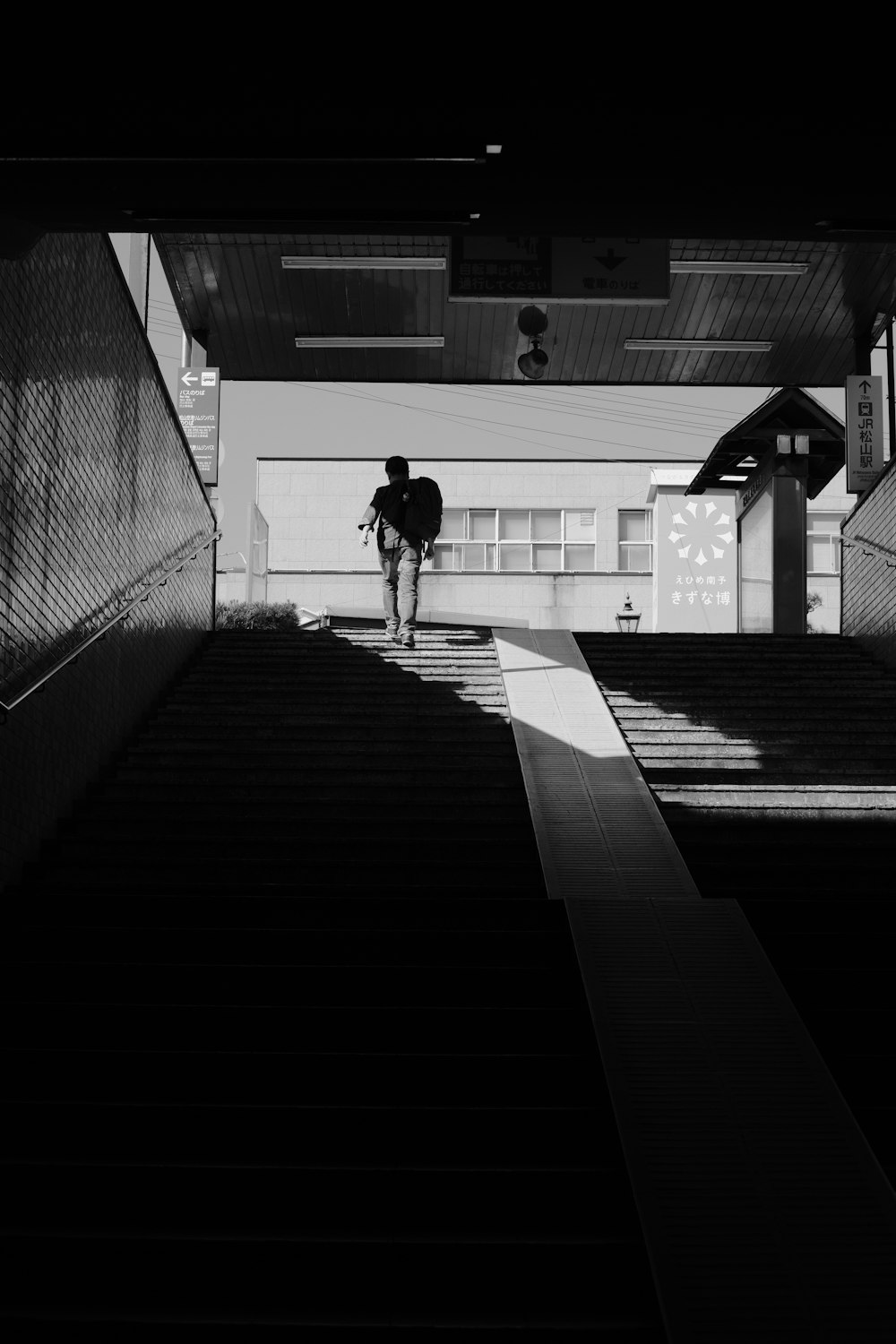 a person walking up a flight of stairs