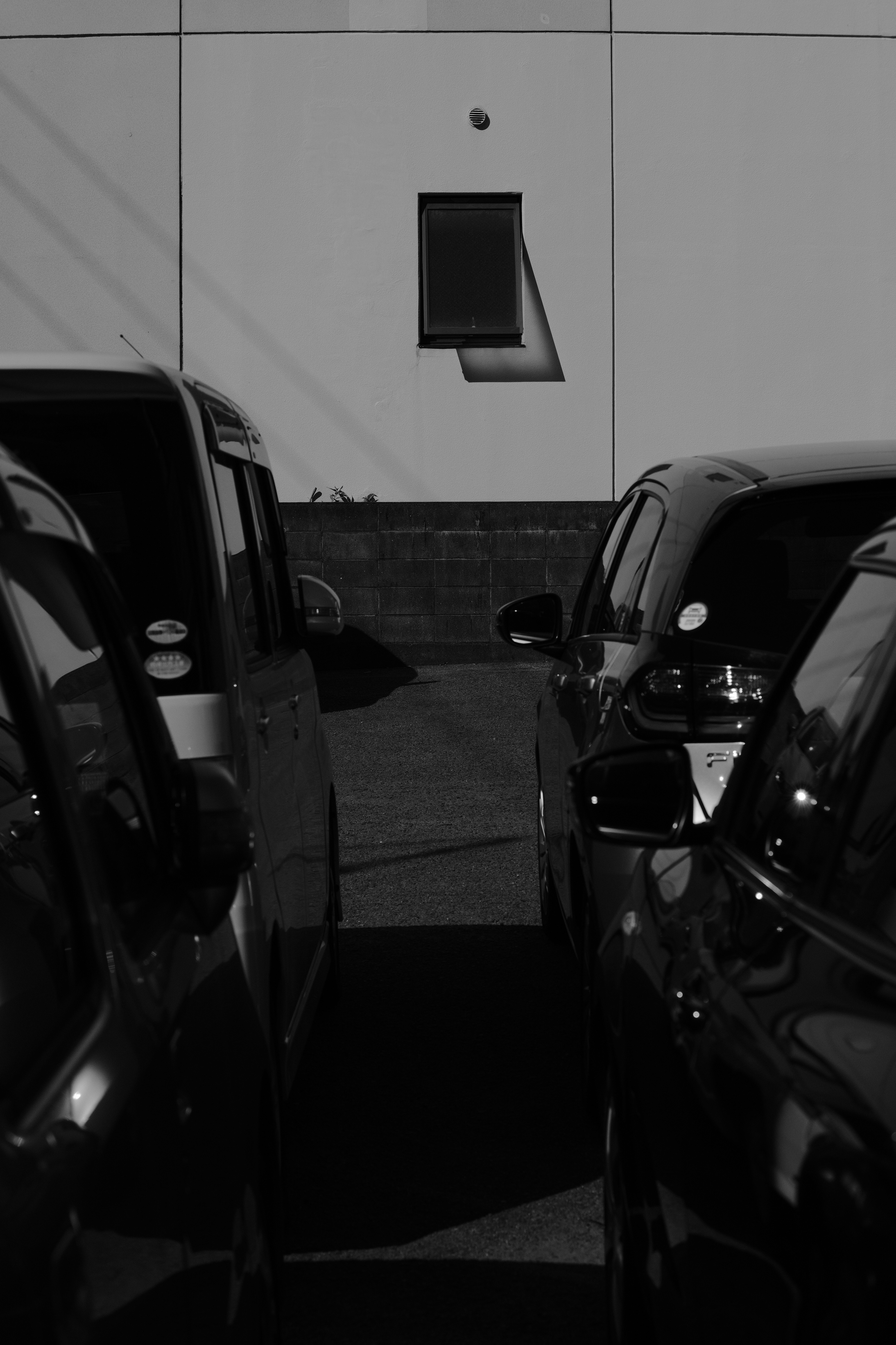 a black and white photo of a parking lot