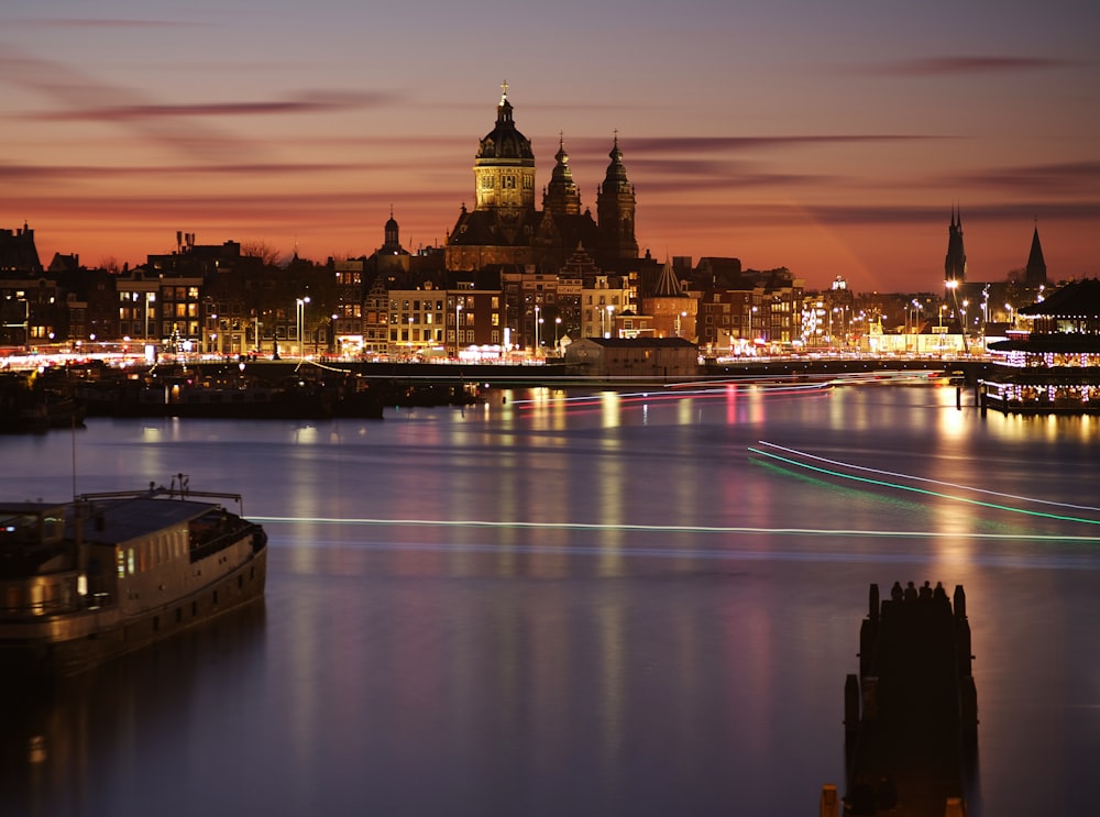 a large body of water with a city in the background