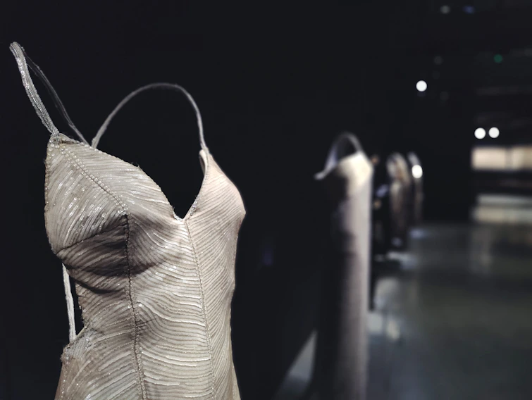 Close-up of a finely tailored modest executive dress with delicate stitching details.