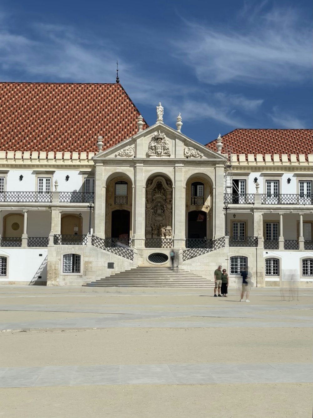 a large white building with a red roof